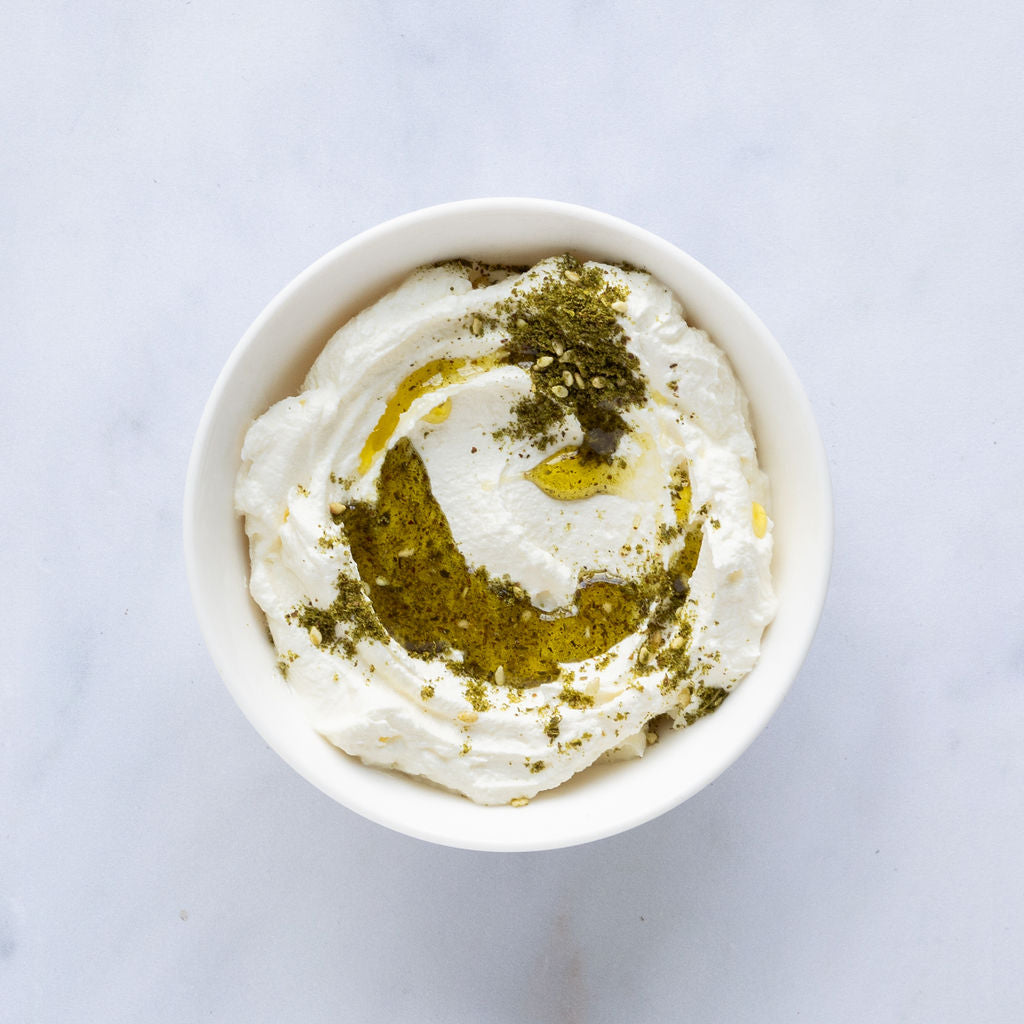 labneth creamy middle eastern cheese in a bowl with herbs